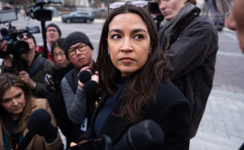 Alexandria Ocasio-Cortez at a campaign rally after using professional makeup and styling services