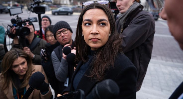 Alexandria Ocasio-Cortez at a campaign rally after using professional makeup and styling services
