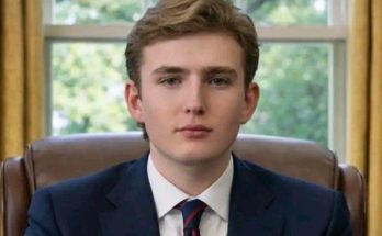 Barron Trump standing quietly at public event