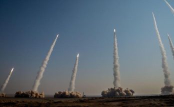 Emergency responders search rubble after rocket barrage destroyed residential buildings