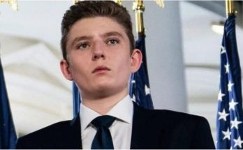 Barron Trump standing beside family publicly