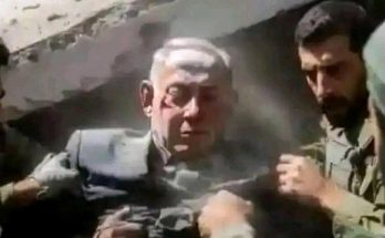 rescue operation with soldiers aiding injured man in rubble