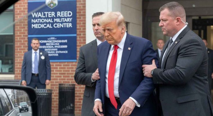 security escorts man in suit outside Walter Reed hospital