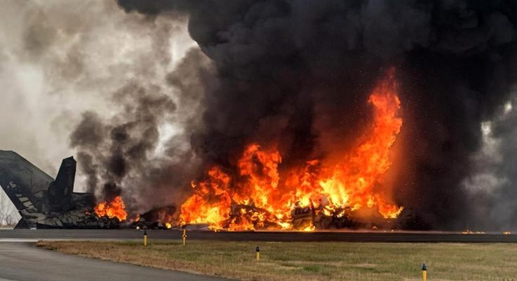 massive fire engulfing a crashed aircraft on runway