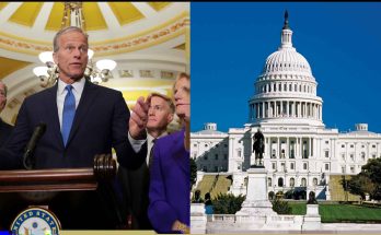 politician speaks in Capitol building with colleagues listening attentively